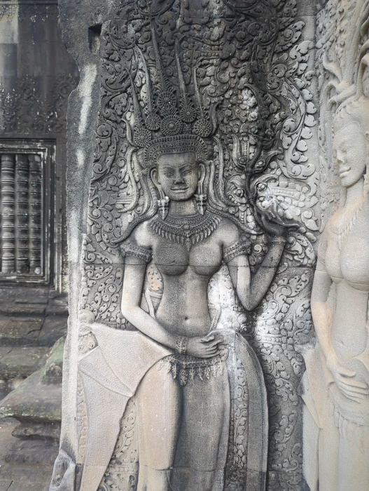 Ancient carvings Angkor Wat temple walls
