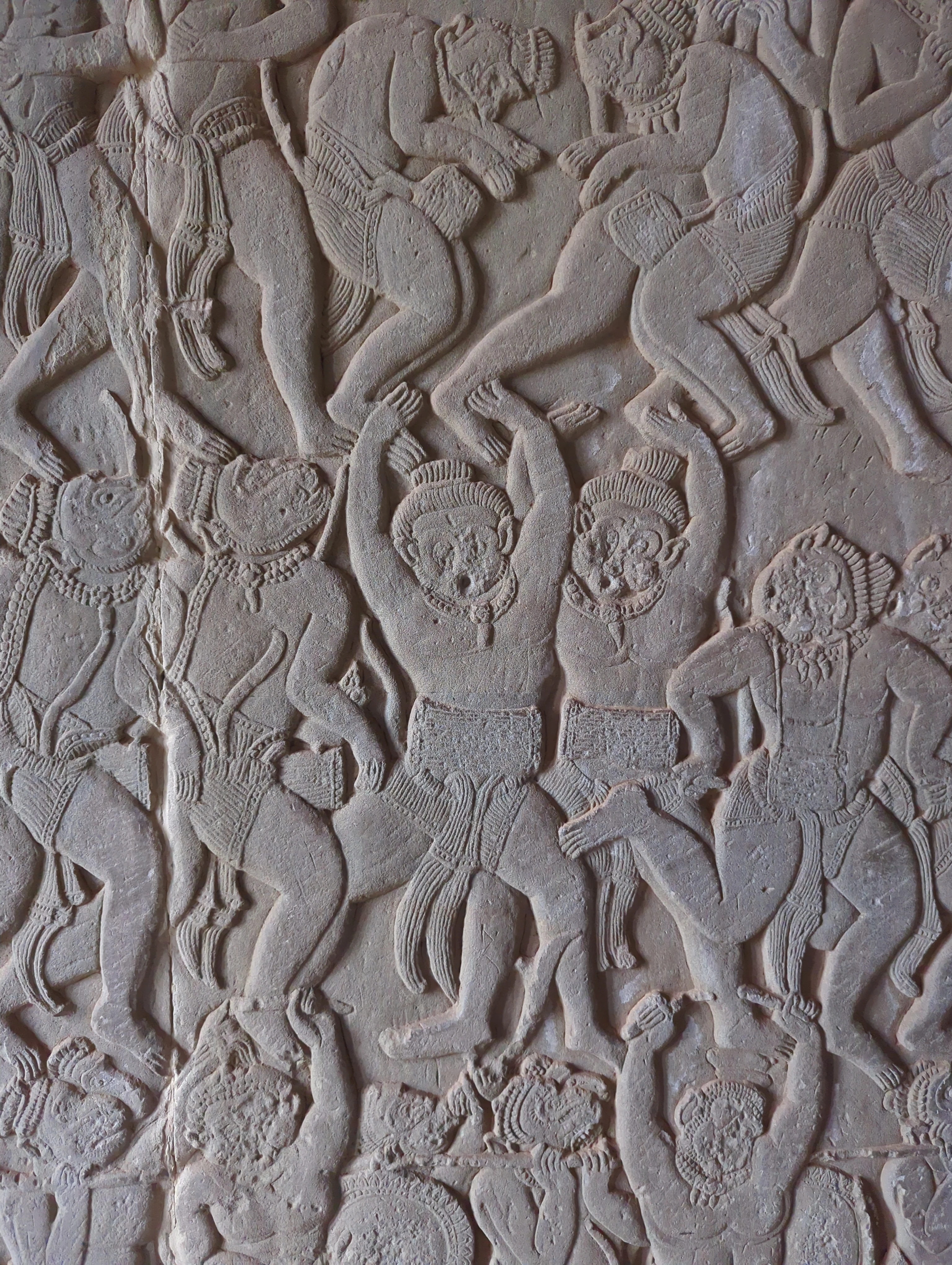 Decorative sandstone relief carving with floral patterns at Angkor Wat