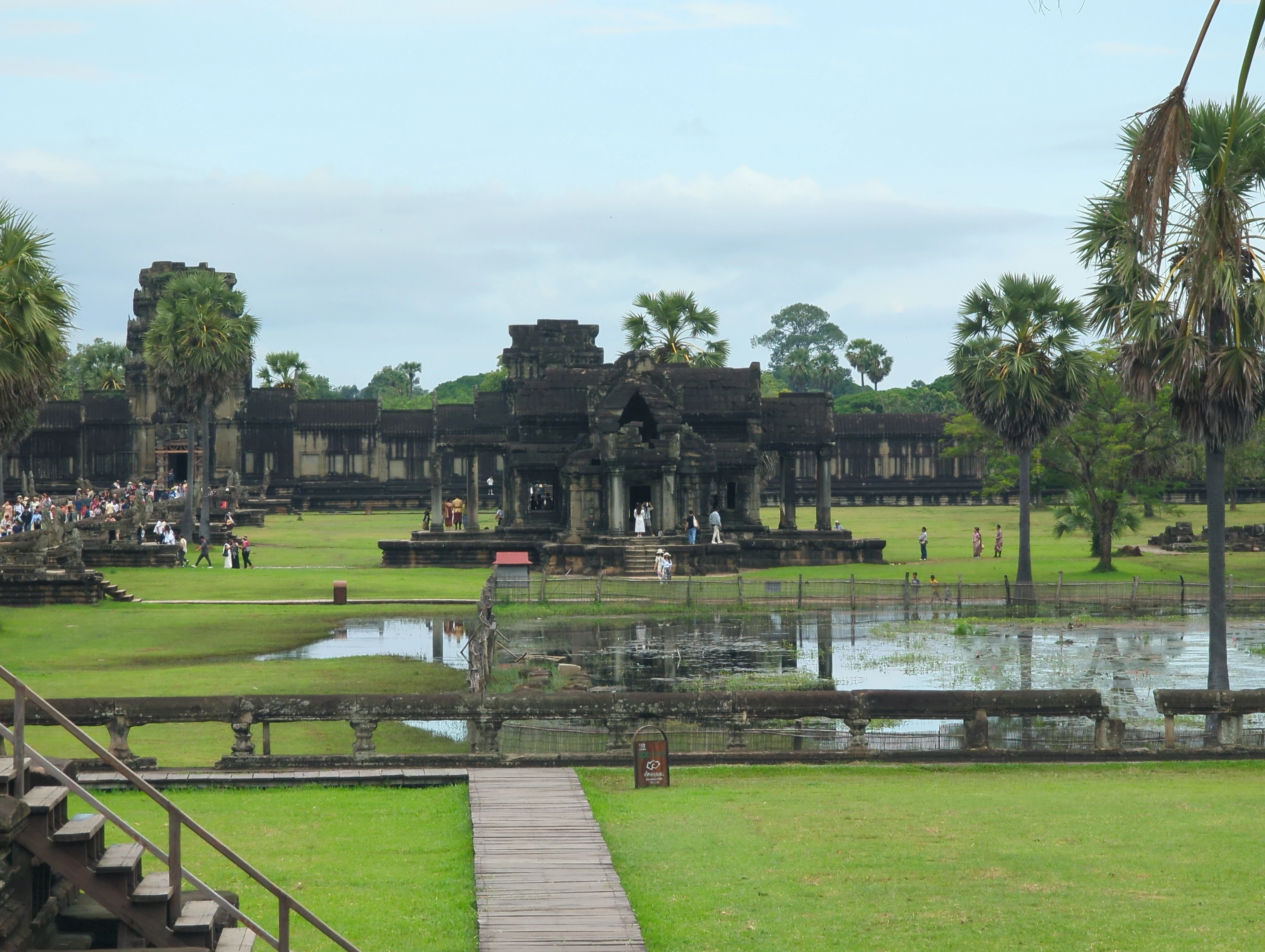 Long corridor with stone columns inside Angkor Wat temple