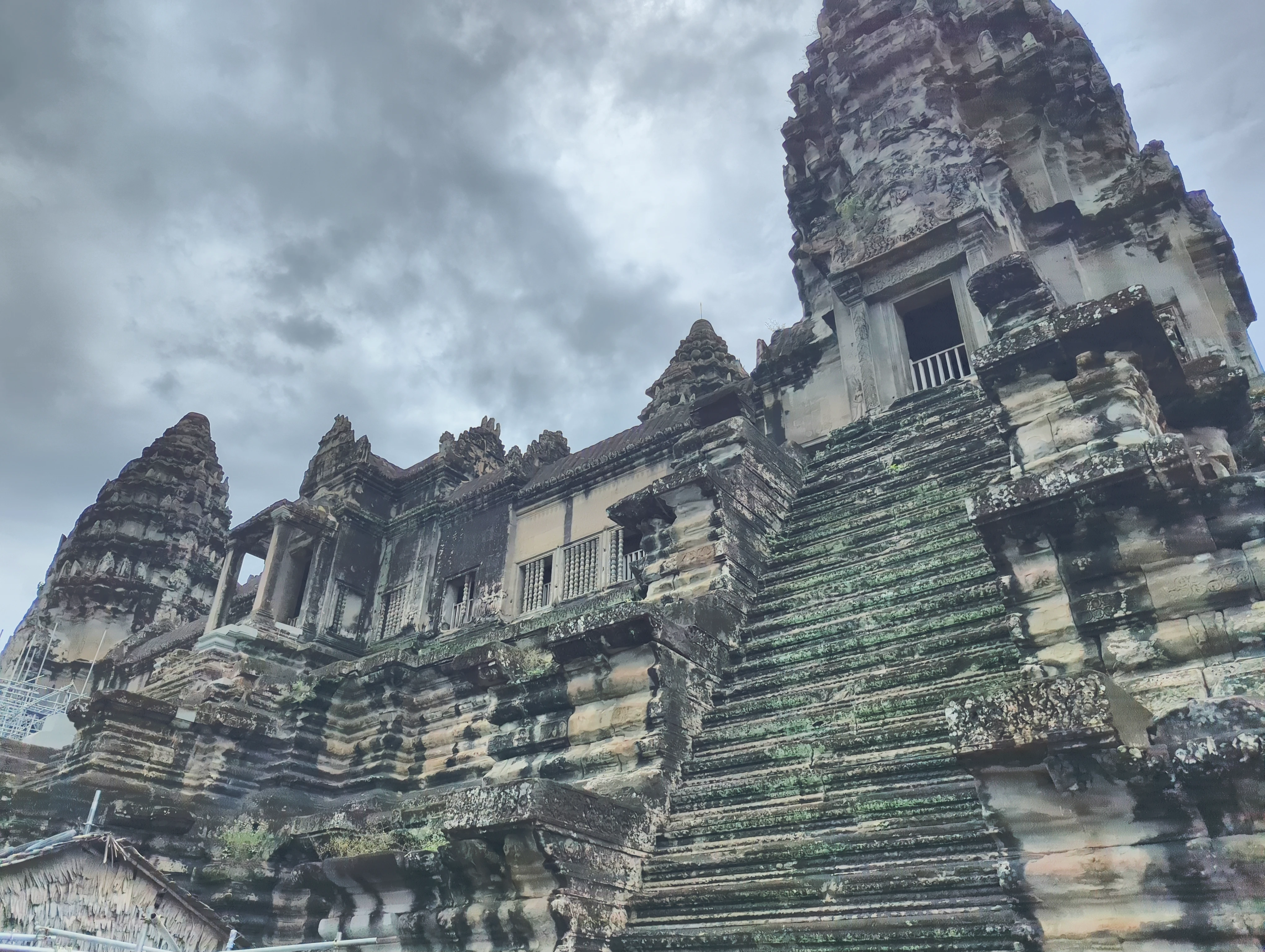 Angkor Wat temple towers rising above palm trees in Cambodia