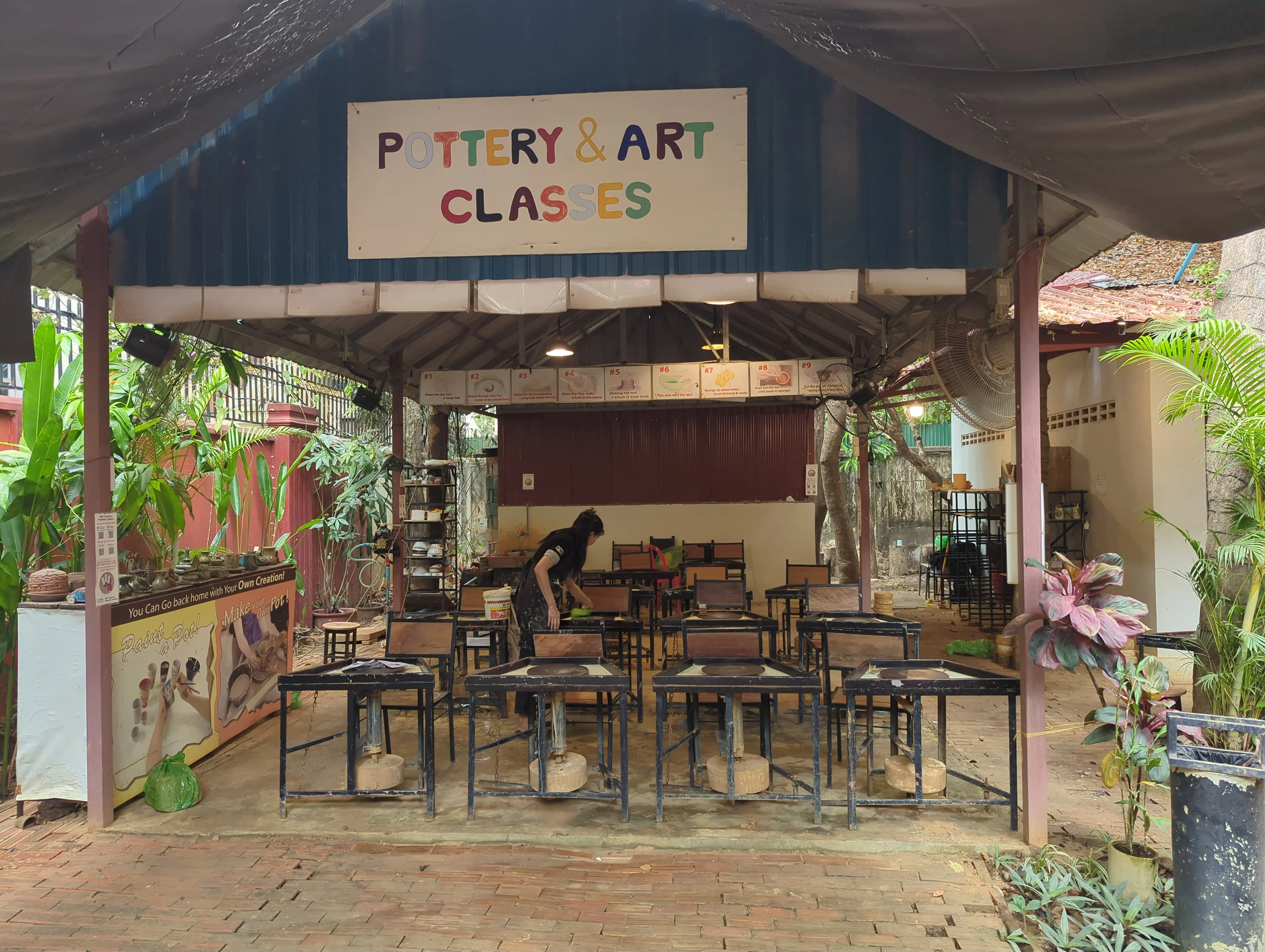 Visitors participating in pottery class in Siem Reap
